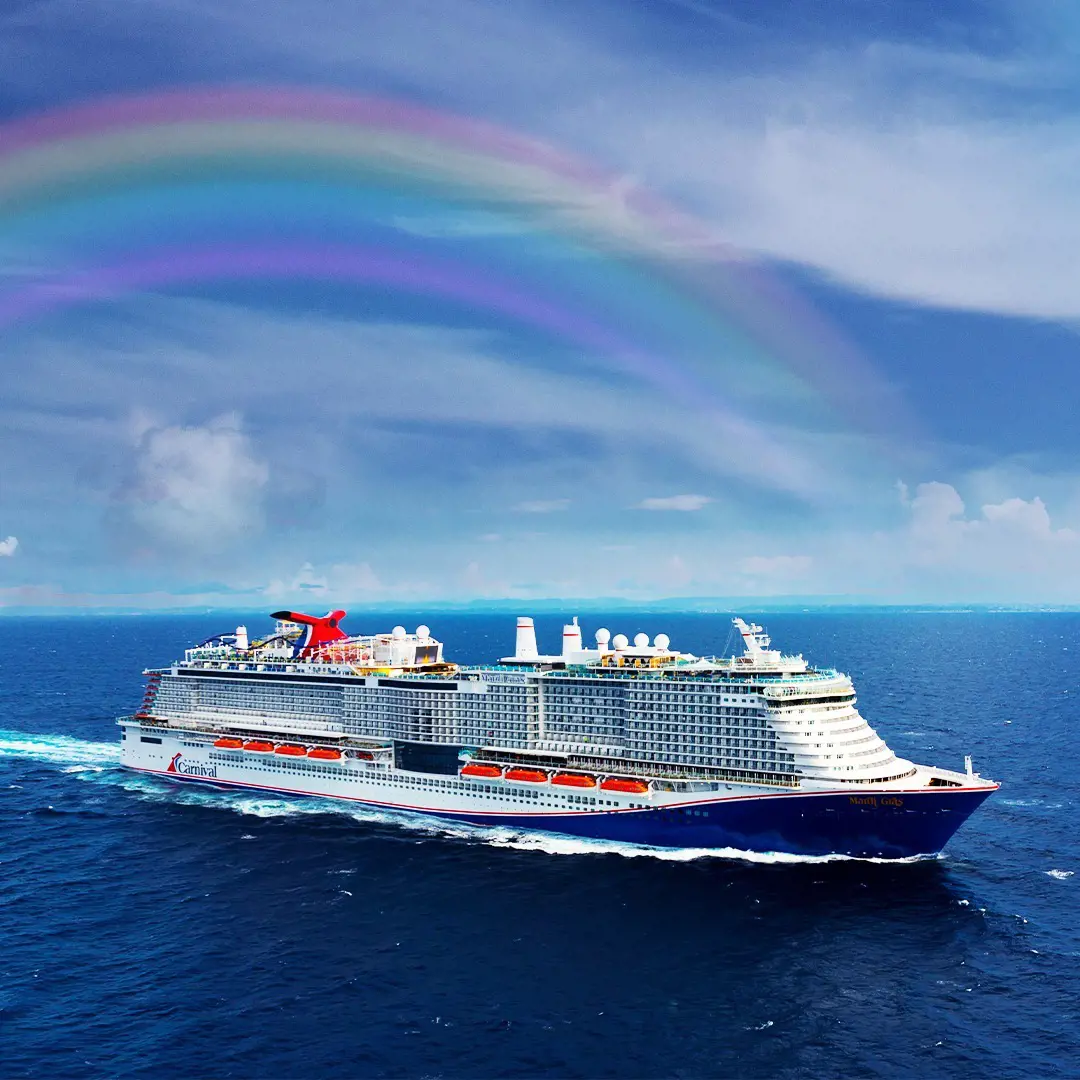 Carnival ship encounters a beautiful rainbow.