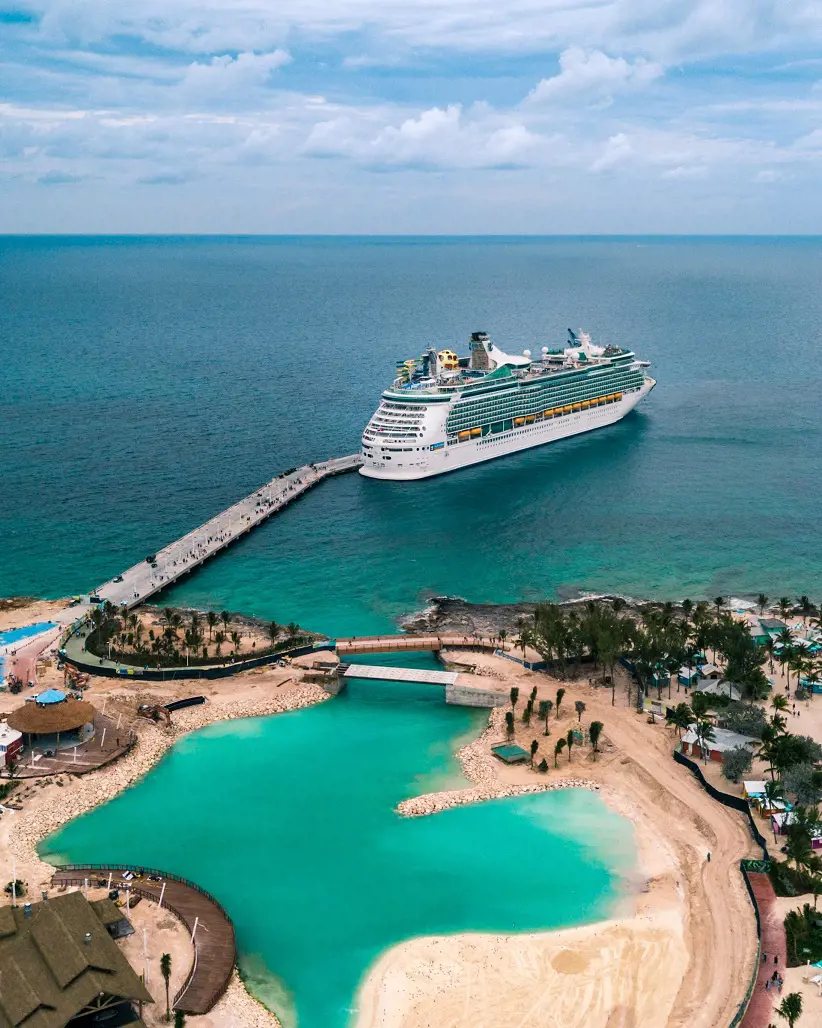 White ship on sea sailing through the Islands of Bahamas.