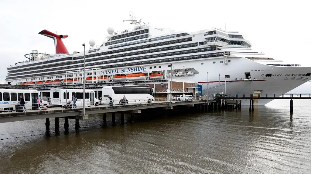 Passengers disembarking from the Carnival Sunshine docked on Charleston cruise port