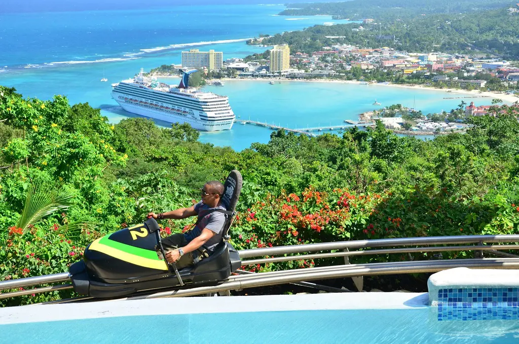 Riding the bobsled through the Ocho Rios city and coast view in Mystic Mountain Bobsled