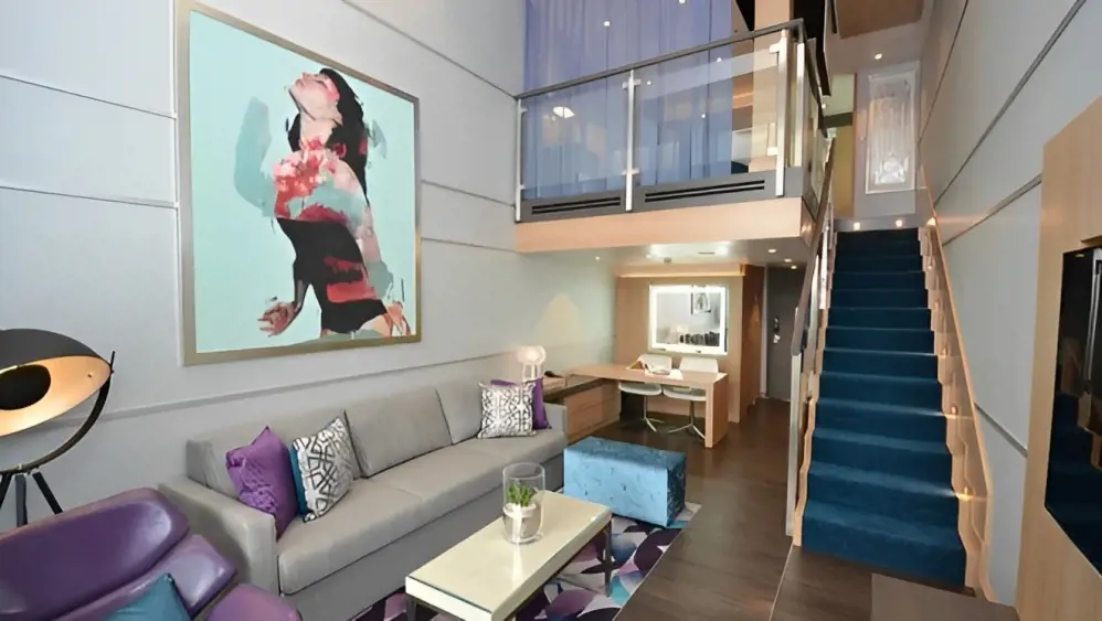 Crown Loft Suite has a large living room with a sofa that converts into a double bed.