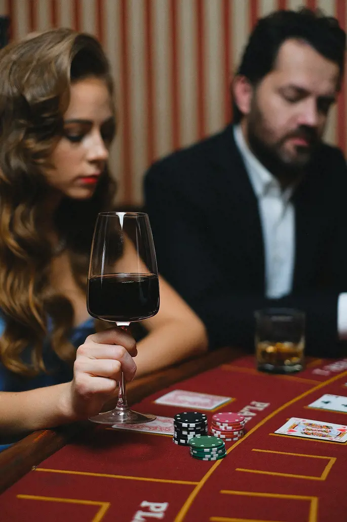 Women and Men playing poker in casino.