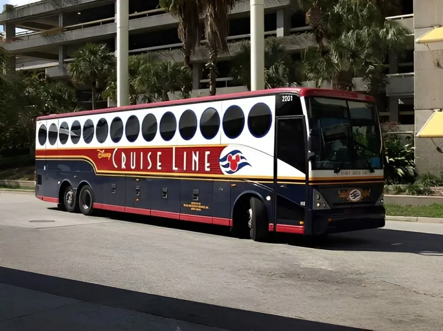 Disney Cruise Line shuttle bus providing ground transportation for cruise passengers.